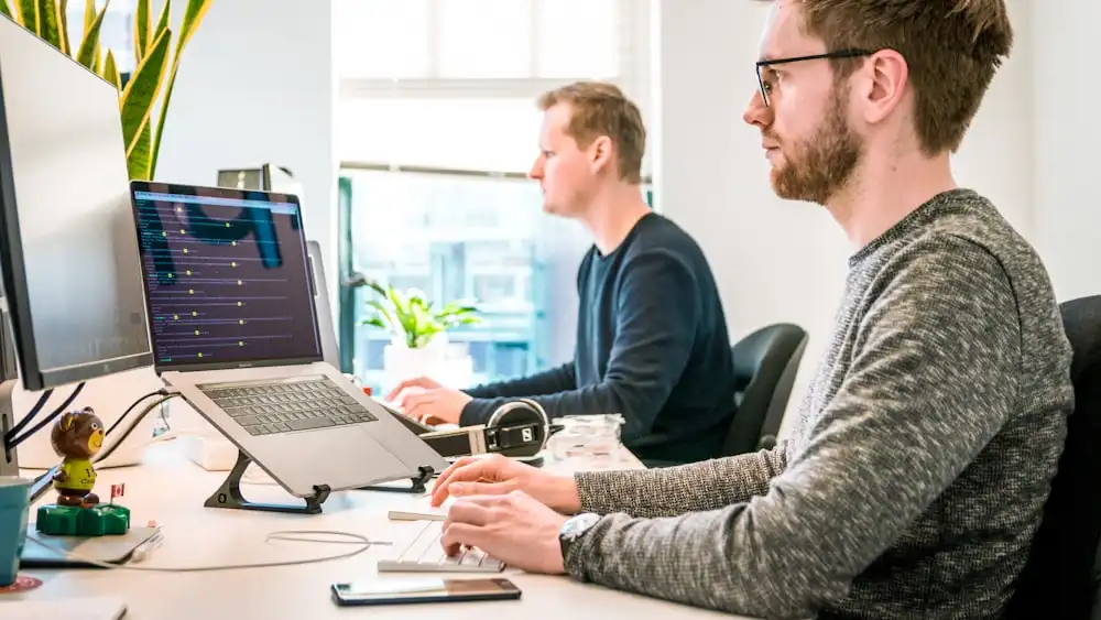 A team building with AI, illustrating the shift from generative AI to agentic AI